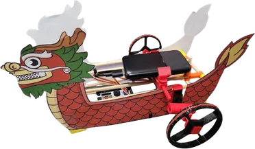 A dragon boat with a red hull, running on a wheel