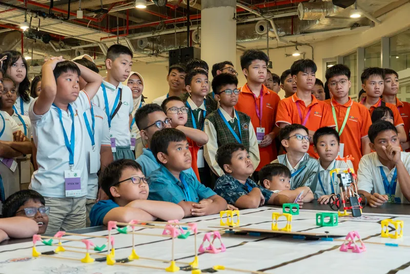 Gathered around the tabletop obstacle course