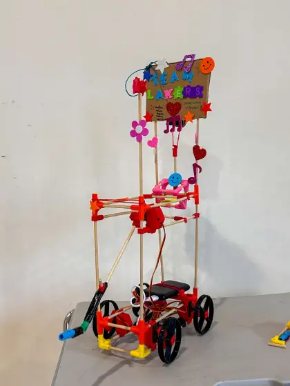 A cart topped with flowers and a heart