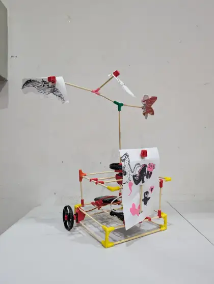 A crane arm dangling paper decorations