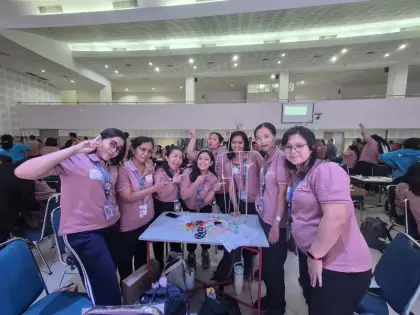 A hall of cheering teachers
