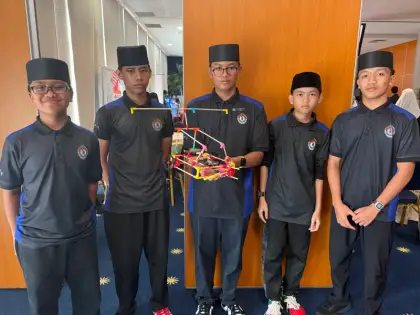 Boys in Brunei with their robot