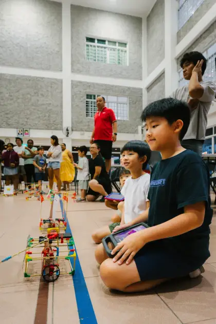 Racing a robot while the crowd watches