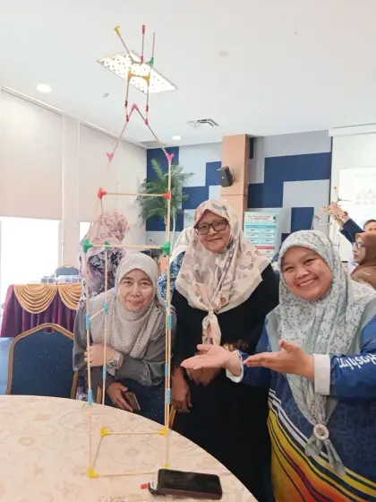 Teachers by a ceiling-high tower
