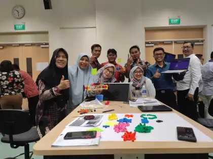Teachers with their cars and the Clawbot app