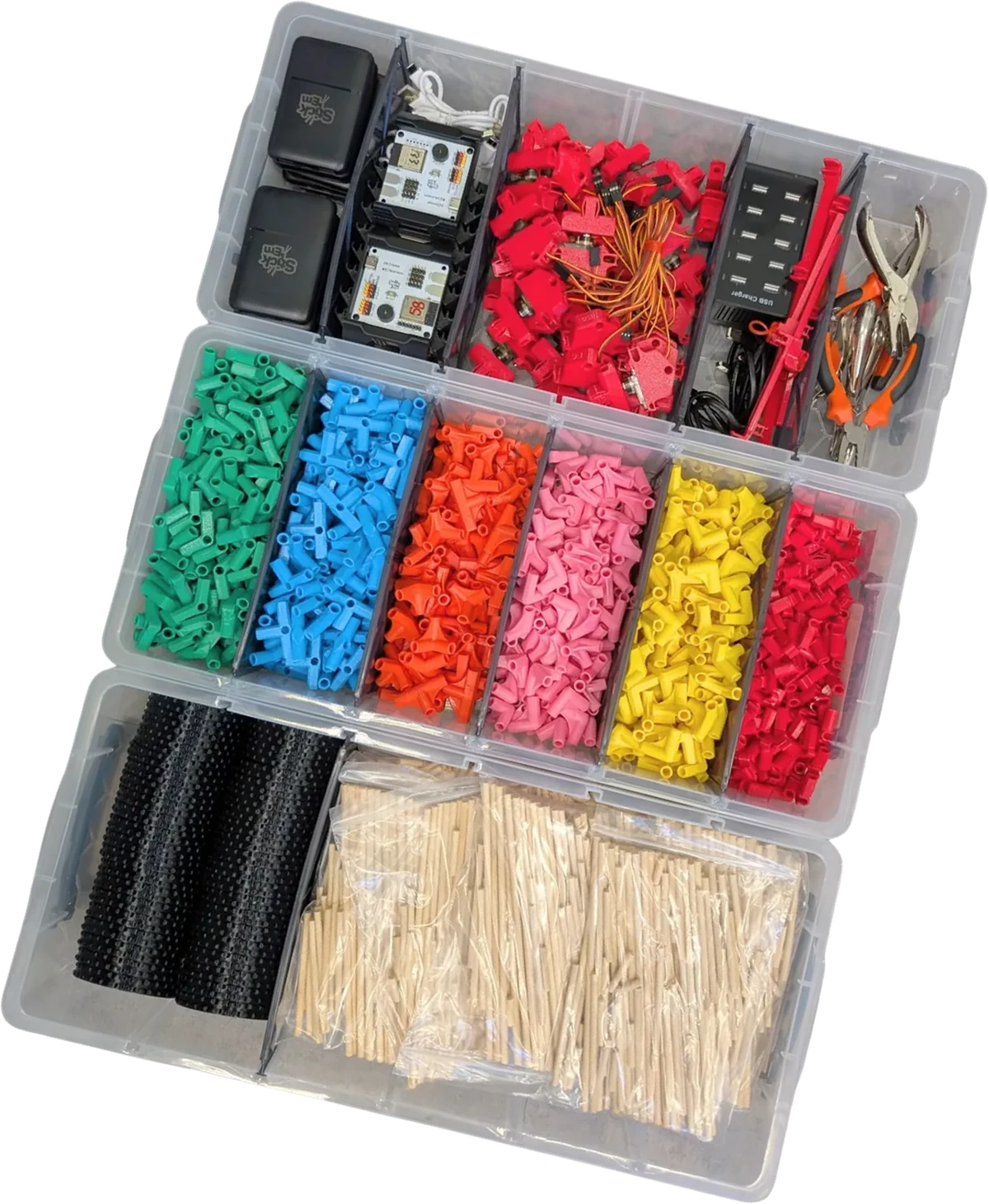 An open Stick ’Em Classroom Set, tilted, showing the trays of coloured connectors, chopsticks, boards and motors