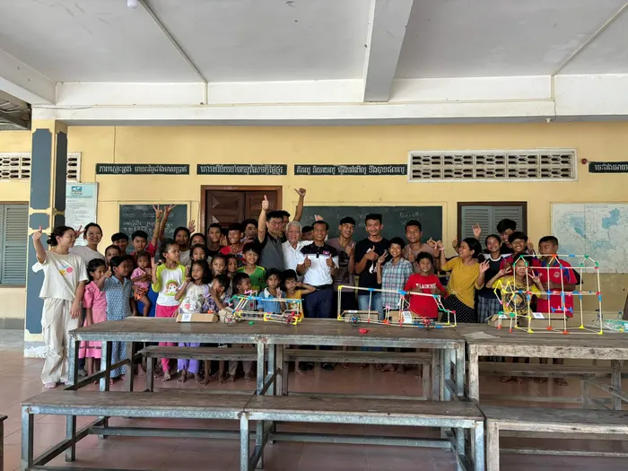 A hall full of children at a Stick ’Em session in Cambodia